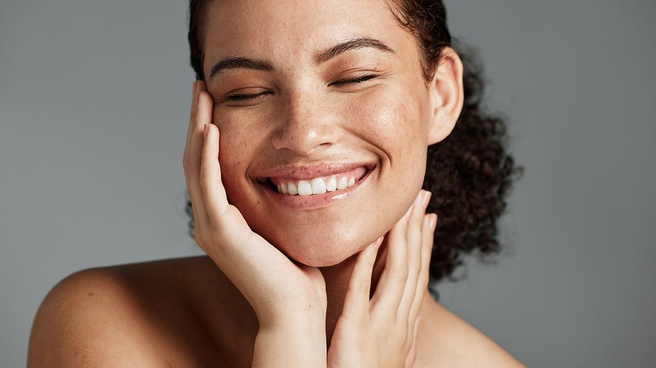 Face, beauty and satisfaction with a black woman gray background, natural skincare.